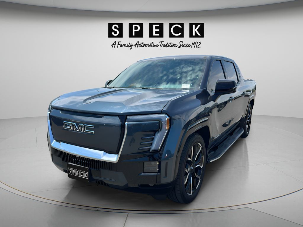 2025 GMC Sierra EV Extended Range Denali in Deep Ocean Metallic — front three-quarter view