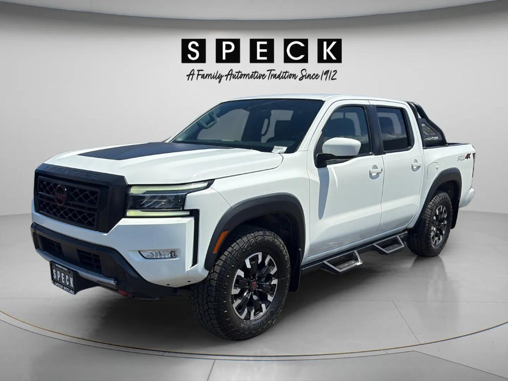 2022 Nissan Frontier Crew Cab PRO-4X 4x4 in Glacier White — front three-quarter view