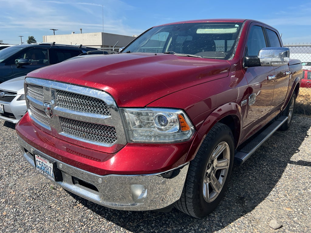 2015 RAM 1500 Laramie Longhorn in Deep Cherry Red Crystal Pearlcoat — front three-quarter view